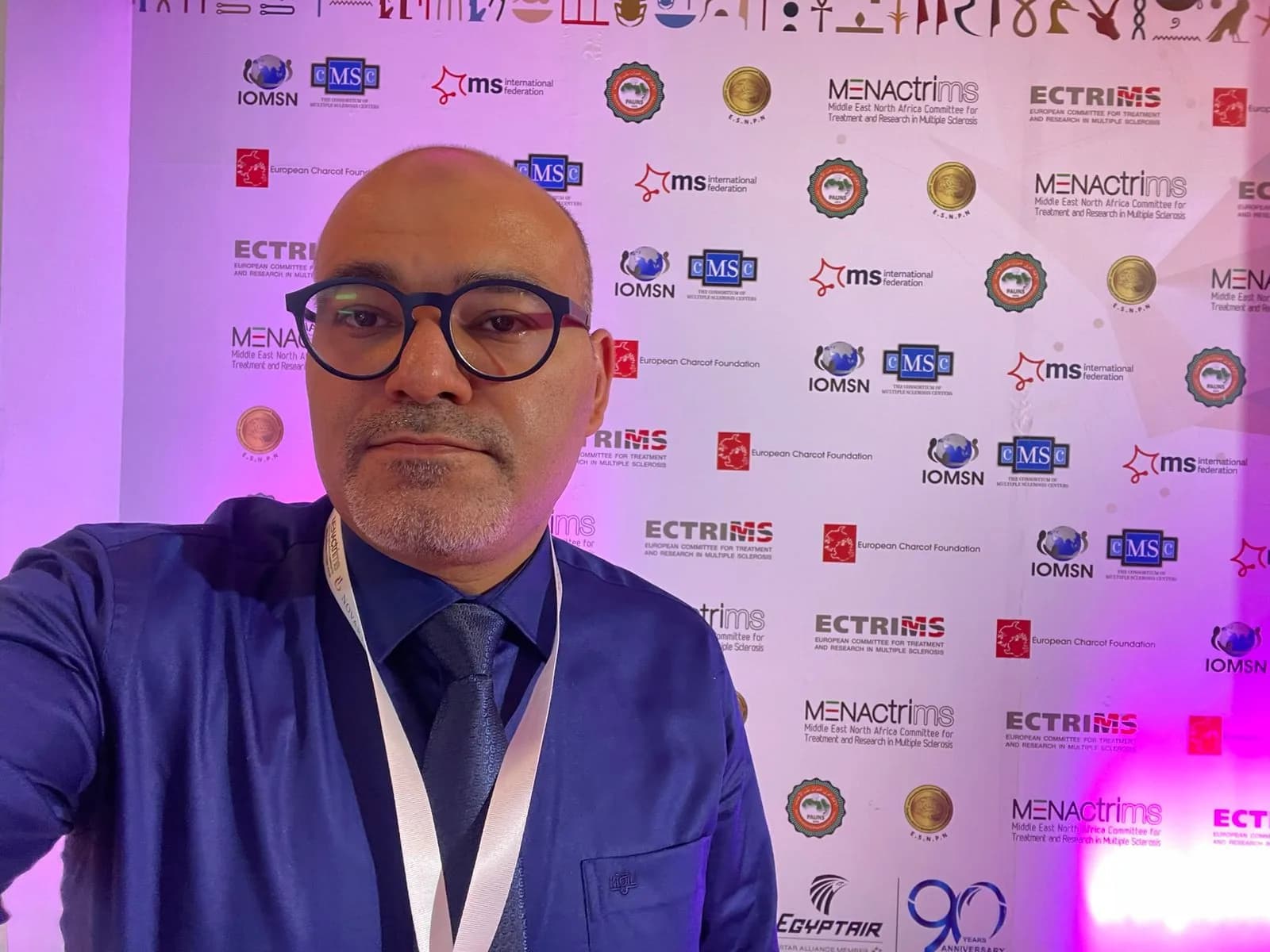Dr. Ahmed Ebied representing at major international neurology congresses, including MENACTRIMS and ECTRIMS.